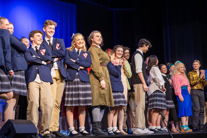 Students perform onstage